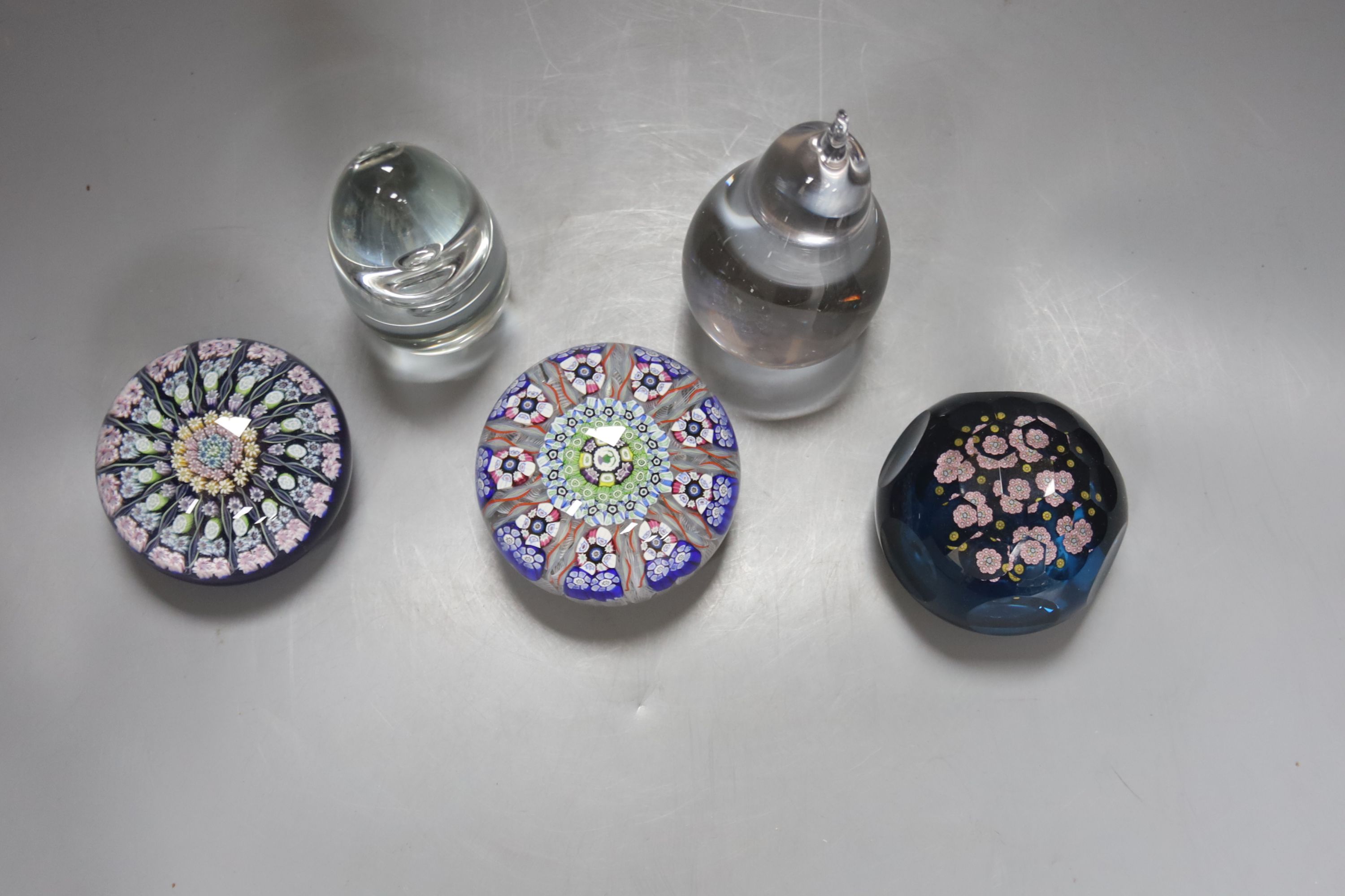 A selection of Scottish and other glass paperweights to include two Perthshire Millefiori examples, another millefiori and two Wedgwood